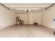 A spacious, empty garage with a water heater, utility connections, and a white door, ready for storage or parking at 1367 S Country Club Dr # 1327, Mesa, AZ 85210
