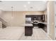 Spacious kitchen features an island, stainless appliances and tile flooring at 1367 S Country Club Dr # 1327, Mesa, AZ 85210