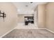 Open living area shows neutral paint, ceiling fan, carpet, and access to kitchen at 1367 S Country Club Dr # 1327, Mesa, AZ 85210