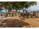 An inviting playground with slides and climbing structures, adjacent to a charming picnic area under a tiled roof at 1367 S Country Club Dr # 1327, Mesa, AZ 85210