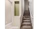 Carpeted staircase with white railing and side wall for a modern feel at 1367 S Country Club Dr # 1327, Mesa, AZ 85210