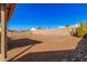 Large gravel backyard featuring desert landscaping at 14352 W Lamoille Dr, Surprise, AZ 85374