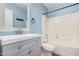 Well-lit bathroom featuring light blue walls, a vanity, and a shower/tub combo at 14352 W Lamoille Dr, Surprise, AZ 85374