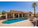 A refreshing pool and outdoor living space with a covered patio and manicured landscaping at 14390 W Morning Star Trl, Surprise, AZ 85374