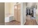 Bathroom with stand alone soaking tub and views of the primary bedroom at 14390 W Morning Star Trl, Surprise, AZ 85374