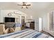 Bedroom features furniture, ceiling fan, kitchenette, and door to exterior at 14390 W Morning Star Trl, Surprise, AZ 85374