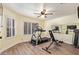 Exercise room features exercise equipment, mirror, and ceiling fan at 14390 W Morning Star Trl, Surprise, AZ 85374