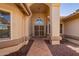 View of the front entrance with security door and tiled walkway at 14390 W Morning Star Trl, Surprise, AZ 85374