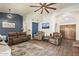 Spacious living room with high ceilings, a ceiling fan, and an open floor plan at 14390 W Morning Star Trl, Surprise, AZ 85374