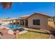 Inviting backyard oasis featuring a sparkling pool, spa, and covered patio, perfect for relaxation and entertaining at 14390 W Morning Star Trl, Surprise, AZ 85374