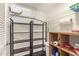 Storage room with shelves and storage bins at 14390 W Morning Star Trl, Surprise, AZ 85374