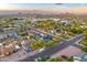 Scenic aerial view of a residential neighborhood with lush greenery and mountain views at 1444 E Coronado Rd, Phoenix, AZ 85006