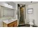 Bathroom featuring a vanity with a marble countertop and a shower with tile surround at 1444 E Coronado Rd, Phoenix, AZ 85006