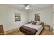 Bright bedroom with wood floors, a ceiling fan, and two windows at 1444 E Coronado Rd, Phoenix, AZ 85006