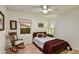 Comfortable bedroom showcasing a rocking chair and window with sunset views at 1444 E Coronado Rd, Phoenix, AZ 85006
