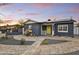 Attractive house with solar panels, nice front yard, and cheerful yellow door at 1444 E Coronado Rd, Phoenix, AZ 85006