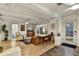 Spacious living room with beamed ceiling, hardwood floors, and cozy seating area at 1444 E Coronado Rd, Phoenix, AZ 85006