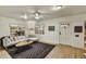 Bright living room with hardwood floors, ceiling fan, and natural light from windows at 1444 E Coronado Rd, Phoenix, AZ 85006