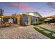 Outdoor brick patio with dining set, shade sails, and exterior lighting, ideal for evening gatherings at 1444 E Coronado Rd, Phoenix, AZ 85006