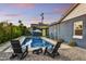 Inviting pool area with stone pavers and modern Adirondack chairs, perfect for outdoor relaxation and entertaining at 1444 E Coronado Rd, Phoenix, AZ 85006