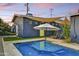 Charming backyard featuring a pool, patio with furniture, and a cozy hammock at 1444 E Coronado Rd, Phoenix, AZ 85006