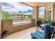This spacious balcony has comfortable seating and views of lush landscaping at 14950 W Mountain View Blvd # 7209, Surprise, AZ 85374