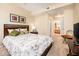 A cozy bedroom with carpet flooring, neutral walls, and decorative art at 14950 W Mountain View Blvd # 7209, Surprise, AZ 85374