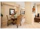 Elegant dining area adjacent to the kitchen, perfect for everyday meals and entertaining guests at 14950 W Mountain View Blvd # 7209, Surprise, AZ 85374