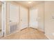 Bright foyer featuring tiled flooring and white doors, offering a clean and welcoming entry at 14950 W Mountain View Blvd # 7209, Surprise, AZ 85374