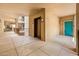 Community hallway with elevator access and doors to residences and common area at 14950 W Mountain View Blvd # 7209, Surprise, AZ 85374