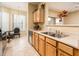 Functional kitchen space with stainless steel appliances and a breakfast nook with great light at 14950 W Mountain View Blvd # 7209, Surprise, AZ 85374