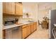 Lovely kitchen providing modern appliances and ample counter space, open to the dining area at 14950 W Mountain View Blvd # 7209, Surprise, AZ 85374
