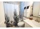 Stylish bathroom featuring a cactus-themed shower curtain, marbled tile, and modern fixtures at 1513 E Sheridan St, Phoenix, AZ 85006