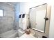 Bright, updated bathroom with marble tile, modern vanity, mirror and decorative towels at 1513 E Sheridan St, Phoenix, AZ 85006