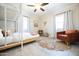 Cozy bedroom with bunk beds, a decorative rug, and a comfortable chair for relaxing at 1513 E Sheridan St, Phoenix, AZ 85006