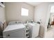 Functional laundry room featuring a washer, dryer, and convenient storage space at 1513 E Sheridan St, Phoenix, AZ 85006