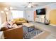 Cozy living room with stylish decor, comfortable seating, and a modern entertainment center at 1513 E Sheridan St, Phoenix, AZ 85006
