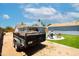 View of the backyard featuring a trailer, outdoor seating around a firepit and an outbuilding at 1531 S Padre Rd, Apache Junction, AZ 85119