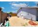 Backyard with a satellite dish and utilities leaning against a block wall at 1531 S Padre Rd, Apache Junction, AZ 85119