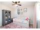 bedroom featuring a daybed with storage, ceiling fan, and pink carpet at 1531 S Padre Rd, Apache Junction, AZ 85119