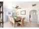 Open concept dining room with bright light, tile flooring, and modern stainless-steel refrigerator at 1531 S Padre Rd, Apache Junction, AZ 85119