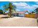Beautiful home features mature trees, low maintenance desert landscaping, and a private gated drive at 1531 S Padre Rd, Apache Junction, AZ 85119