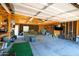 Spacious garage features exposed framing, fluorescent lighting, and ample space for storage and activities at 1531 S Padre Rd, Apache Junction, AZ 85119