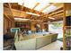 Spacious garage featuring exposed framing, fluorescent lighting, and ample room for storage and relaxation at 1531 S Padre Rd, Apache Junction, AZ 85119