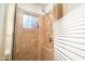 Shower stall with tiled walls, rainfall shower head, and frosted glass door at 1531 S Padre Rd, Apache Junction, AZ 85119