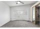 Spacious bedroom with plush carpet, bay window, and sliding door closet at 1784 E Torrey Pines Ln, Chandler, AZ 85249
