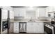 Modern kitchen featuring stainless steel appliances and granite countertops at 1784 E Torrey Pines Ln, Chandler, AZ 85249
