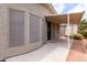 Covered back patio with concrete flooring, privacy walls and lush landscaping at 1784 E Torrey Pines Ln, Chandler, AZ 85249