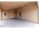 Covered patio with new floor and a door to the interior at 1784 E Torrey Pines Ln, Chandler, AZ 85249