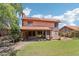 Backyard view showcasing the patio and lush green lawn at 1813 E Sheena Dr, Phoenix, AZ 85022